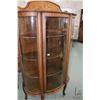 Image 2 : Antique triple curved glass, single door, oak display cabinet with carved claw feet 68" in height in
