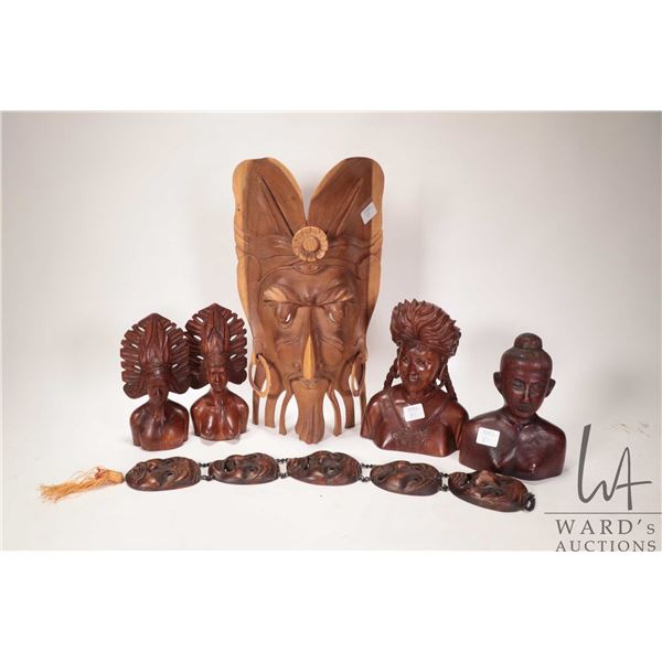 Selection of treenware including busts, 14" mask, wall hanging etc.