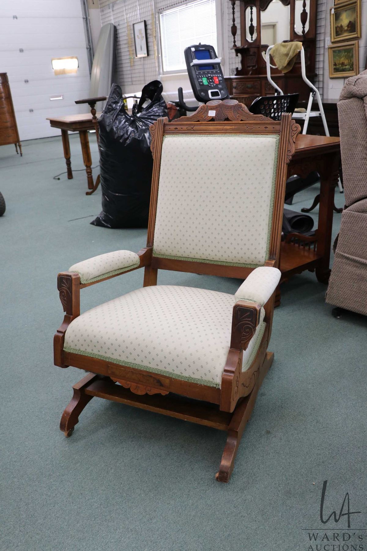 Eastlake platform rocking chair with carved back and low upholstered ...