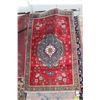 Image 1 : 100% handmade Iranian wool carpet "Tabriz" with center medallion, red background and highlights of g