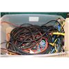 Image 2 : Plastic tub containing a selection of extension cords, power bars and jumper cables
