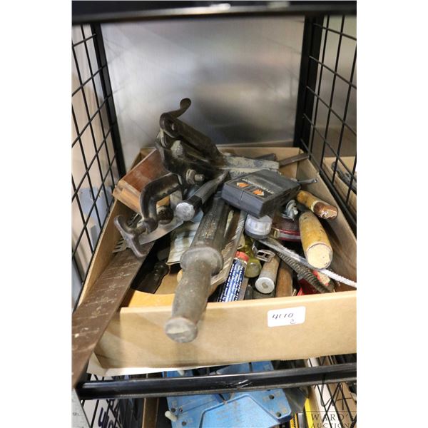 Selection of carpentry hand tools including squares, chisels, saws, files, nail pullers, stud finder