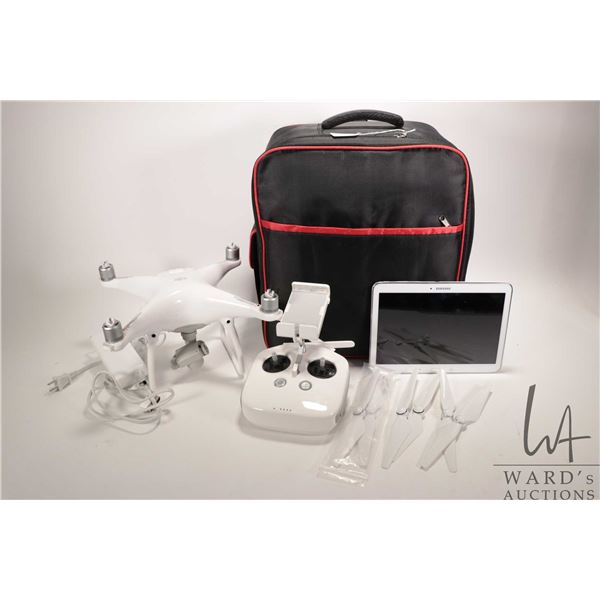 DJI Phantom 4 drone, complete with two batteries, charge cable, remote control with strap, full set