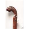 Image 1 : Hand carved wooden cane with knife blade edge and figural anthropomorphic top, 34" in height