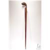 Image 2 : Hand carved wooden cane with knife blade edge and figural anthropomorphic top, 34" in height
