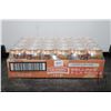 Image 1 : Four 6 packs of Smirnoff Ice Peach Bellini cans / 24 count X 355 ml / 5.0% ABV  Note: Alcohol cannot