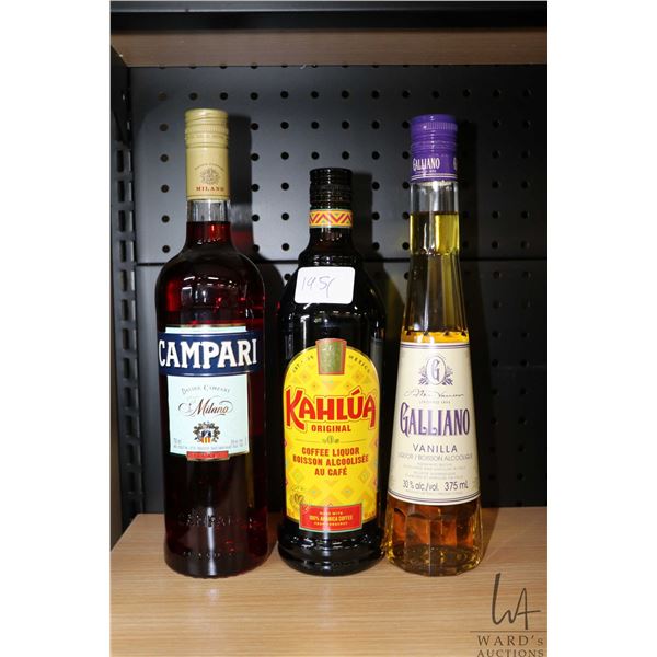 Three bottles of assorted liqueur including one Campari Milano Bitter 750ml / 25% ABV, one Kahlua Co