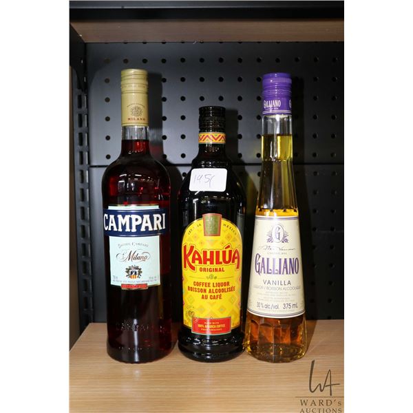 Three bottles of assorted liqueur including one Campari Milano Bitter 750ml / 25% ABV, one Kahlua Co