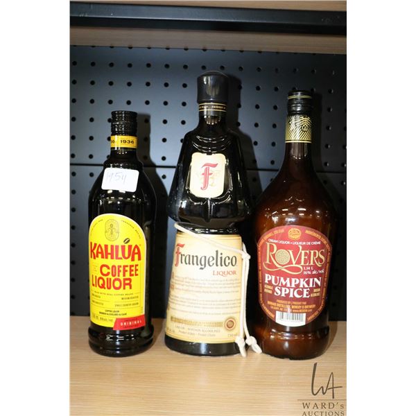 Three bottles of assorted liqueurs including one Kahlua coffee liquor 750ml / 16% ABV, one Frangelic