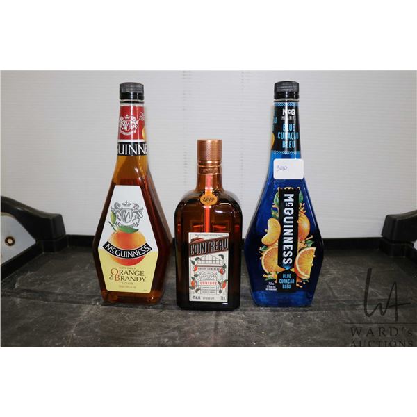 Three assorted bottles of liquor including one McGuiness Orange & Brandy 750ml / 35% ABV, one McGuin