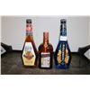 Image 1 : Three assorted bottles of liquor including one McGuiness Orange & Brandy 750ml / 35% ABV, one McGuin