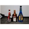 Image 1 : Three assorted bottles of liquor including one McGuiness Blue Curacao 750ml / 15% ABV, one GrandMarn