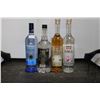 Image 1 : Four assorted bottles of alcohol including one Pinnacle Vodka 750ml / 40% ABV, one T-Rex Vodka 1.14m