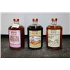 Image 1 : Three bottles of Back 40 Distillery Inc liquor including one bottle of Farmers Blend Coffee Liquor 7