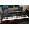 Image 1 : Yamaha PSR 37 keyboard synthesizer, serial no. 085055. Includes manual and power adapter, working at
