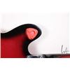 Image 7 : Raven hollow body electric guitar with red burst finish and black pick guard, equipped with Bigsby s