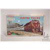 Image 1 : Vintage ATT H.O. scale model train set including power supply, engine, two pieces of rolling stock, 