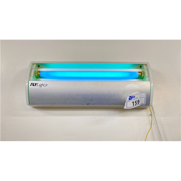FLY LIGHT JUNIOR ELECTRIC BLUE LIGHT BUG ATTRACTING LIGHT WITH STICKY STRIP. LOCATED IN LINE ROOM 2
