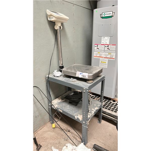 AND DIGITAL SCALE MODEL HV-60KGV ON METAL TABLE. LOCATED OUTSIDE SACHET 2
