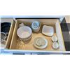 Image 2 : CONTENTS OF PRODUCT TEST KITCHEN. MEASURING CUPS, SPOONS, GLOVES, BOWLS, CUTTING BOARDS, UTENSILS,
