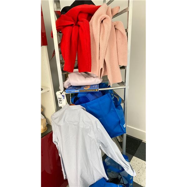 ROLLING RACK AND CONTENTS. CLOTHING, BOOKS, MISC ITEMS