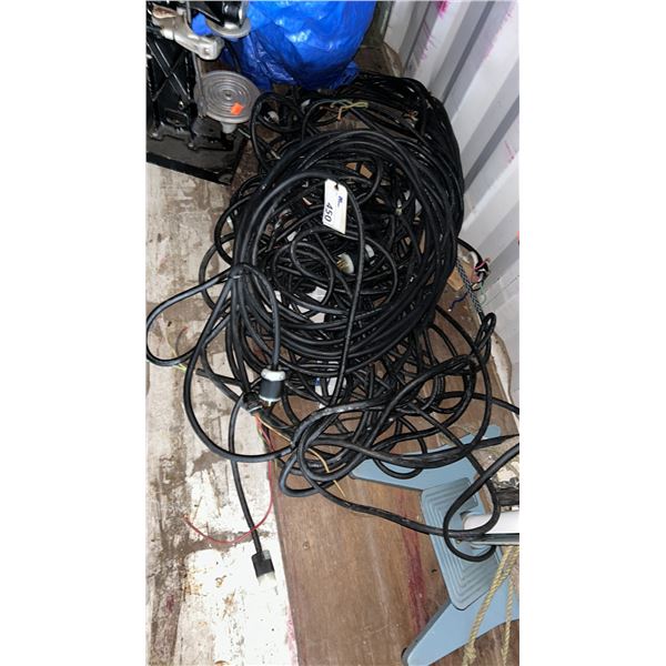 PILE OF EXTENSIONS CORDS, HEAVY GAUGE WIRE WITH 220V ENDS, ASST LENGTHS LOCATED IN CONTAINER