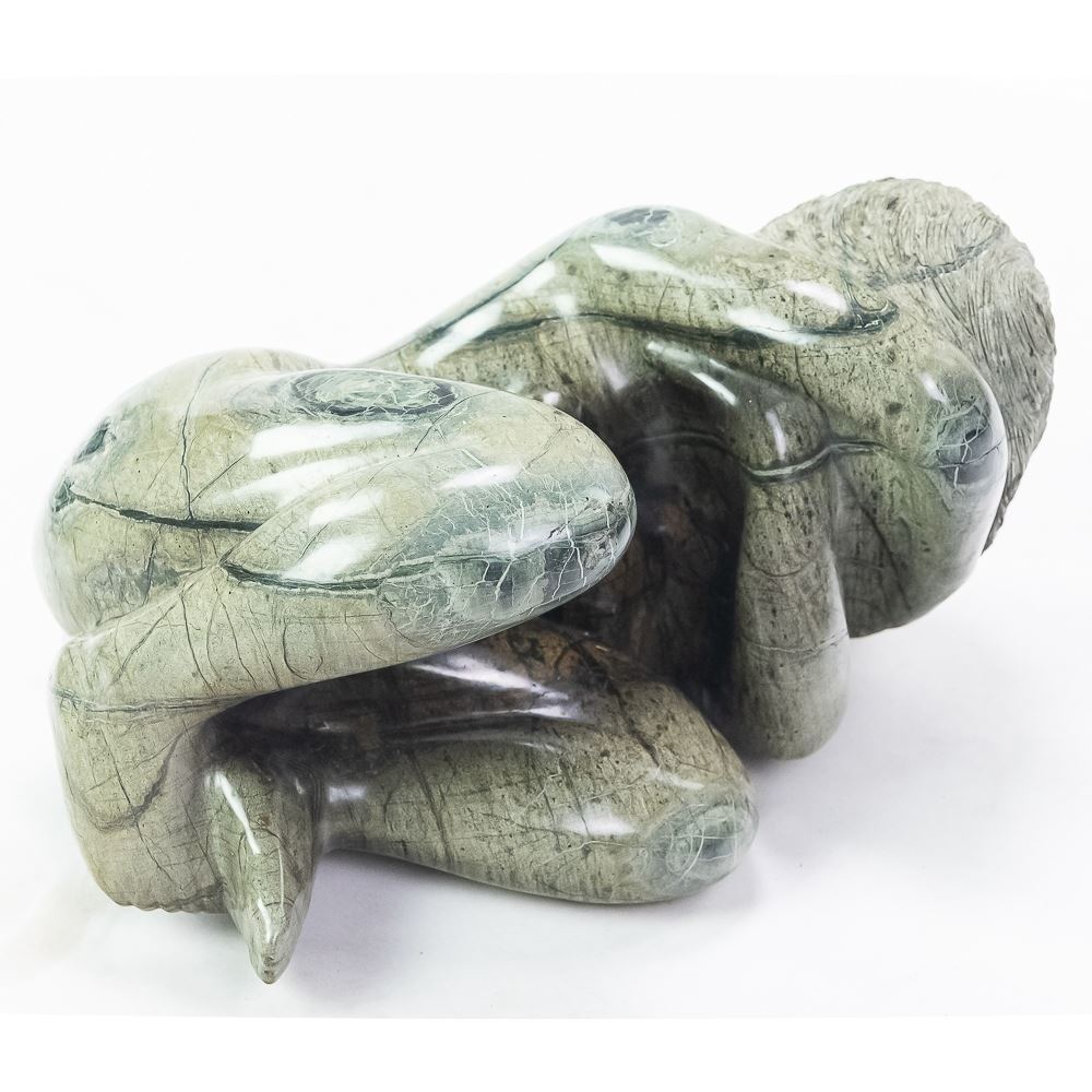 Green Marble Statue Girl Curled Up Rock Formation