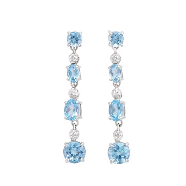 Plated Rhodium and Sterling Silver 7.10ctw Blue Topaz Earrings