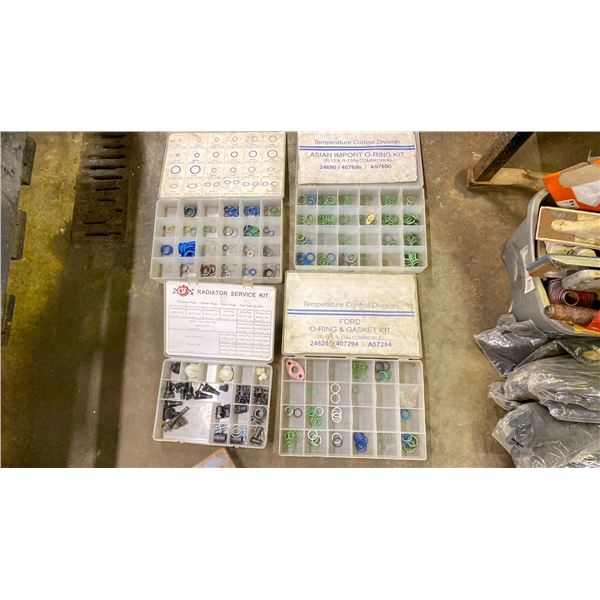 4 PLASTIC BINS WITH RADIATOR AND A/C SERVICE COMPONENTS