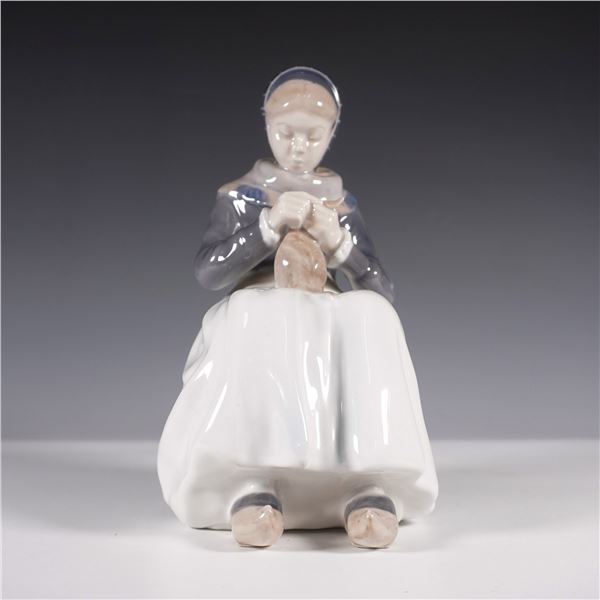 Royal Copenhagen Porcelain Figurine, Woman Knitting 1317