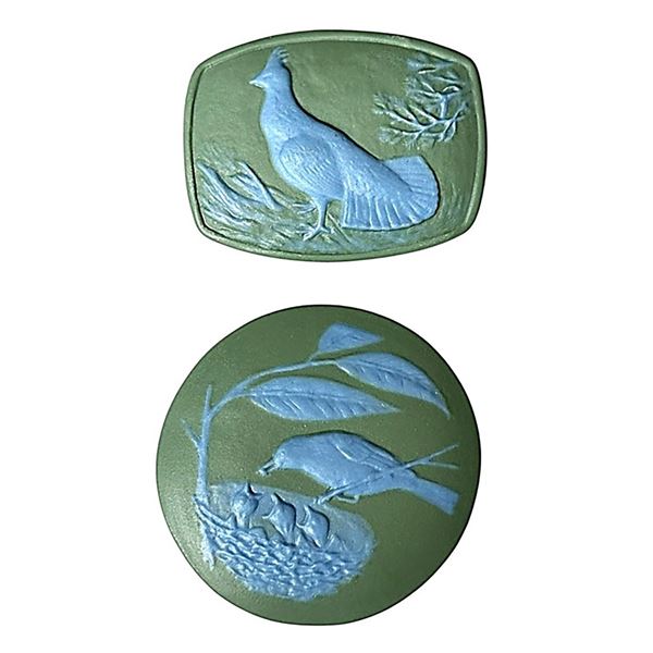 A small card of division three Studio artist buttons
