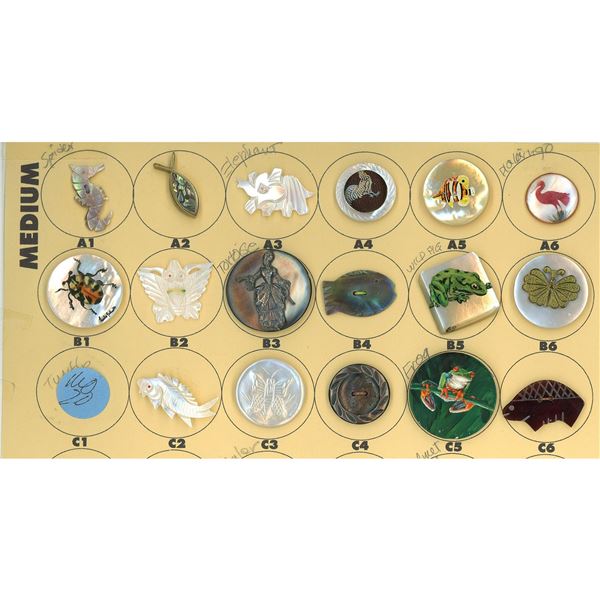 A partial card of div.1 & 3 of assorted pearl buttons
