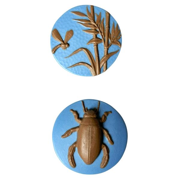 A small card of division three Studio artist buttons