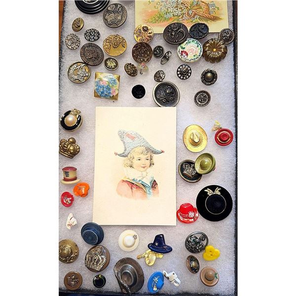 A Riker tray of assorted material buttons