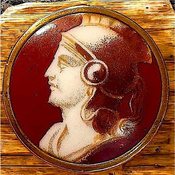 A division one porcelain set in metal pictorial button