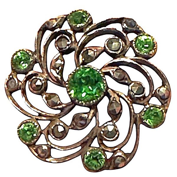 A division one striking pierced jeweled button