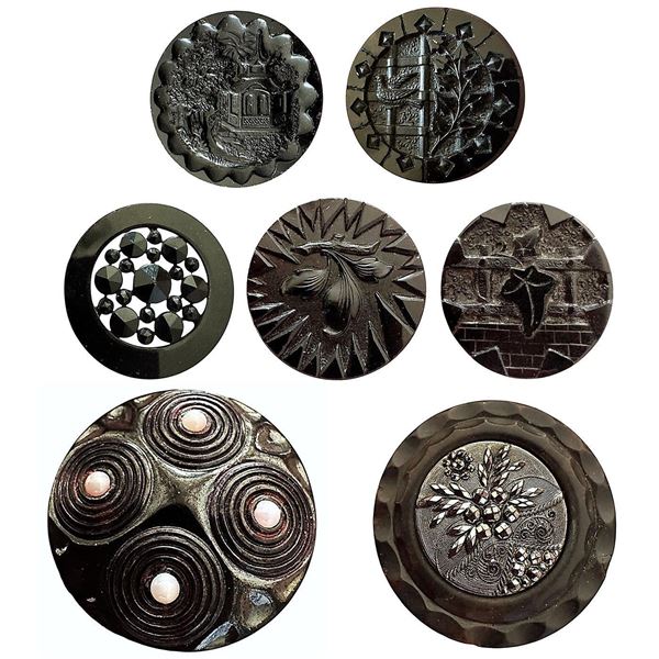 A small card of division one black glass buttons