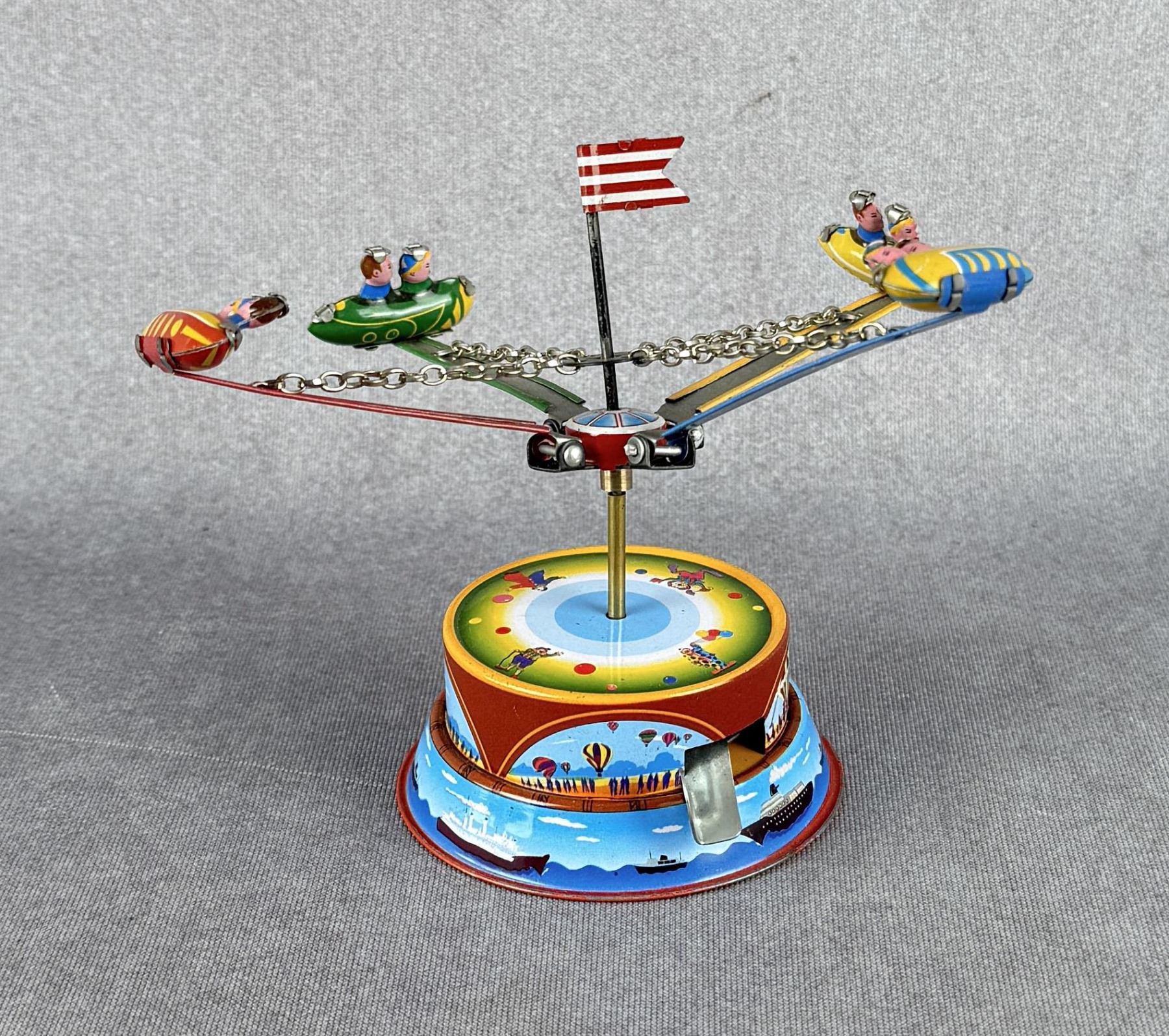 Tin Litho Rocket Ride Carousel Toy