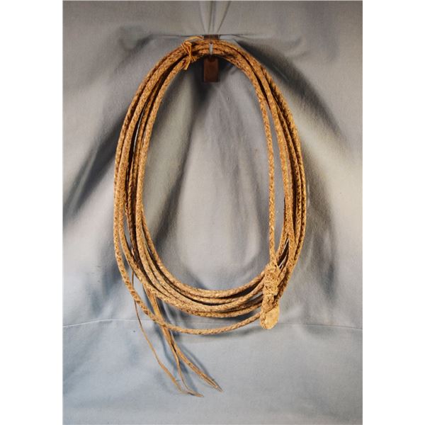 2 pcs: Braided rawhide rope, approx. 35' and Cactus lariat w/leather hondo