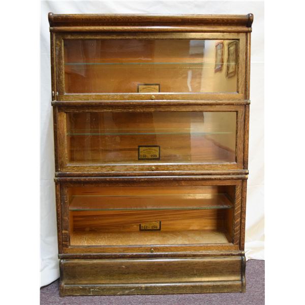 The Globe-Wernicke Co. oak barrister, 3 sections, 50" x 34" x 12", glass shelves, bottom section mis