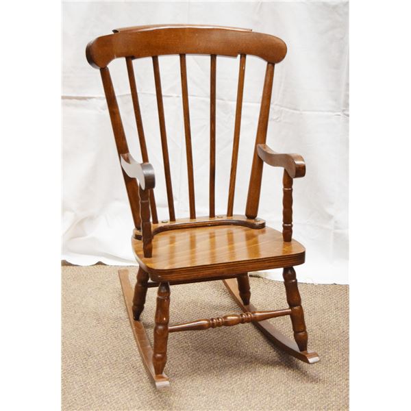 Child's wooden rocker, spindle back with dark stain, 29" tall