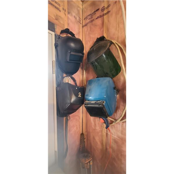 THREE WELDING HELMET AND ONE TINTED FACE SHIELD