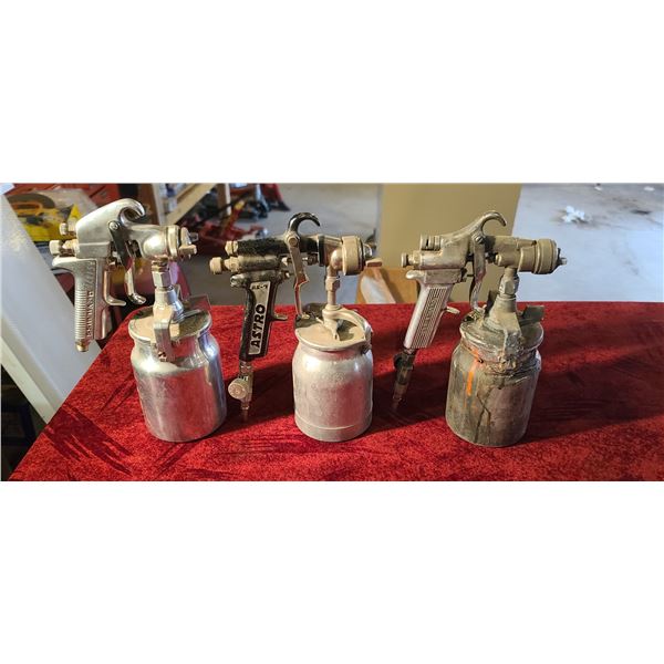 THREE PAINT SPRAY CANS