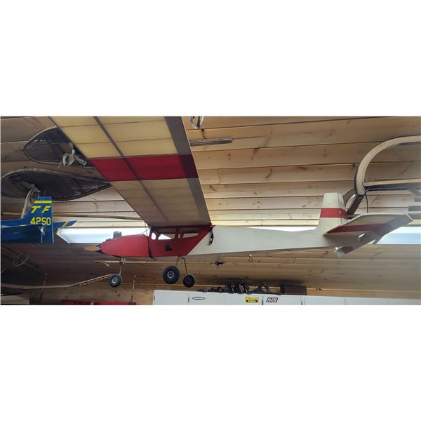 RED AND WHITE R.C. AIRPLANE - NO REMOTE OR STARTER SIZE" APPROX 62" X 48"