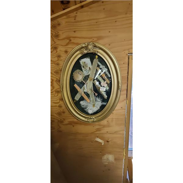 A FRAMED DIARAMA OF HISTORY IN OVAL GLASS FRAME