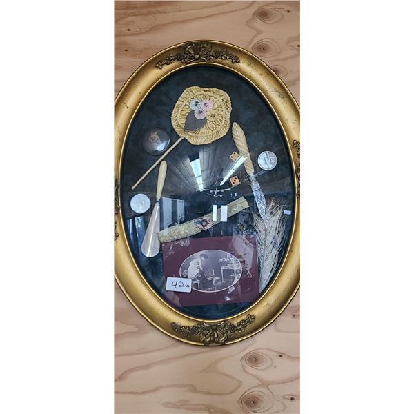 A FRAMED DIARAMA OF HISTORY IN OVAL GLASS FRAME