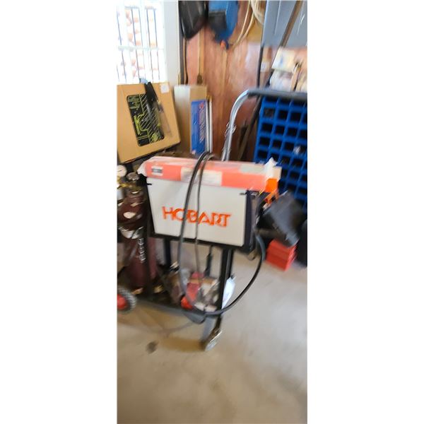 HOBART WELDING MACHINE - MIG MODEL 125 - COMES WITH SOME RODS AND WELDING CART