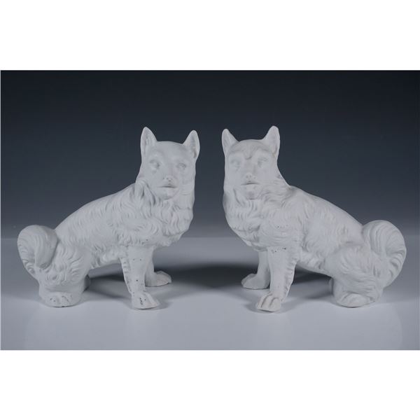 Pair of Bisque Porcelain Dog Figurines