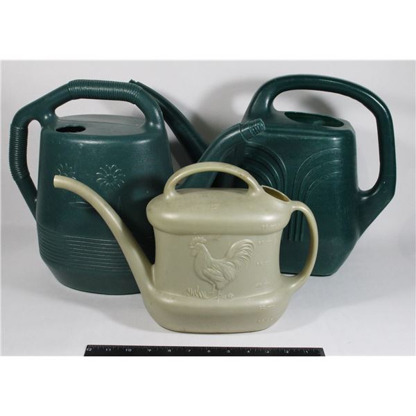 THREE VINTAGE PLASTIC WATERING CANS