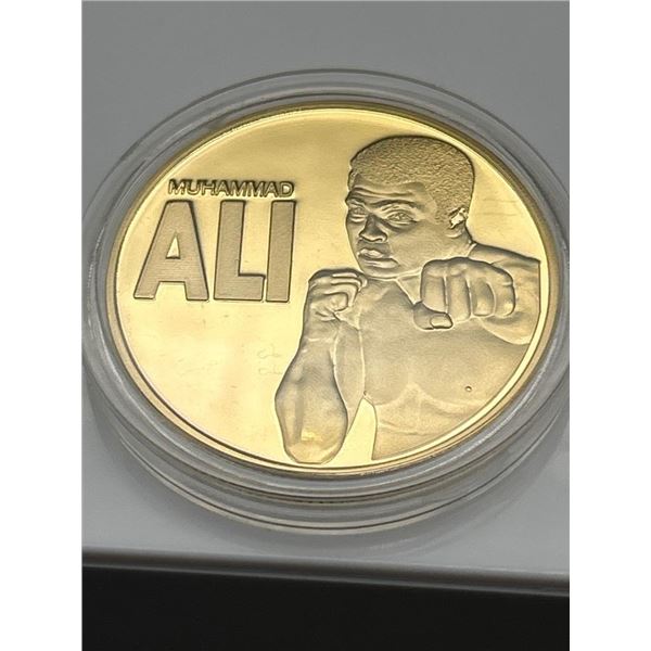 Commemorative Gold-Colored Coin Featuring Muhammad Ali, Heavyweight Champion